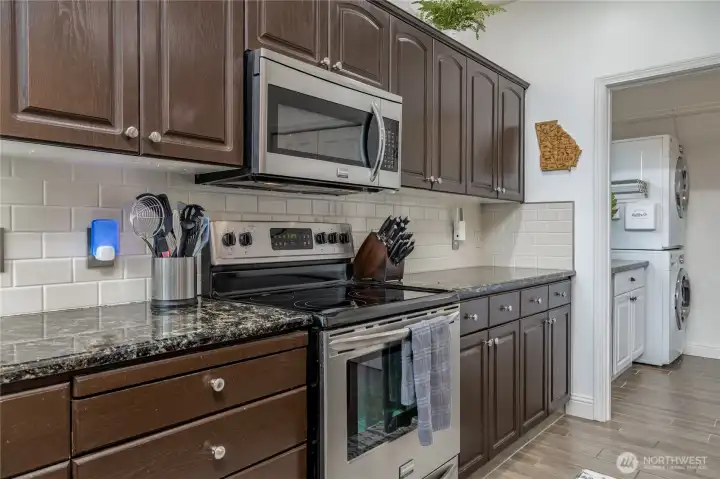 Conveniently located laundry area is tucked away just off the kitchen