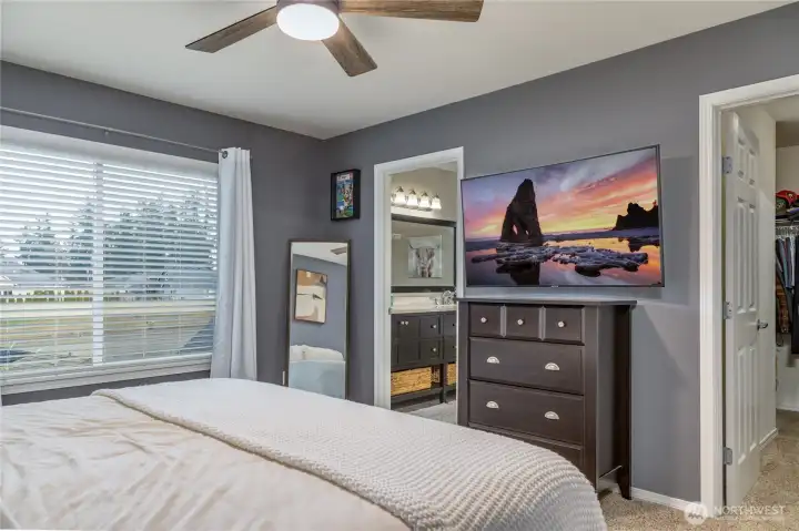 Primary suite features a walk-in closet and private 5-piece bathroom