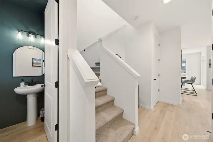 Interior Entrance. Main level half bathroom. Stair case to upper level.