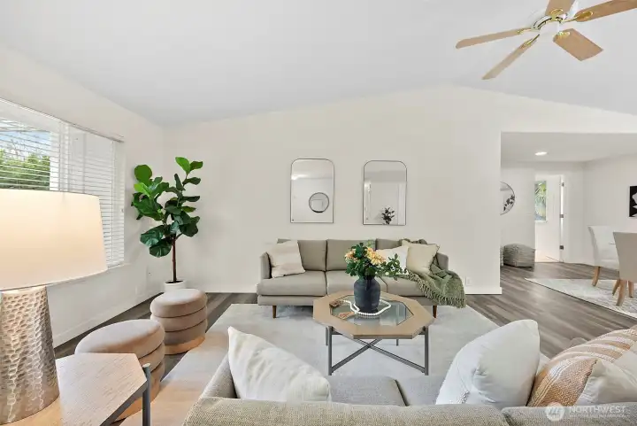 Open floor plan brings plenty of space for movement, entertaining and feeling cozy at home. Facing hallway to the primary suite.