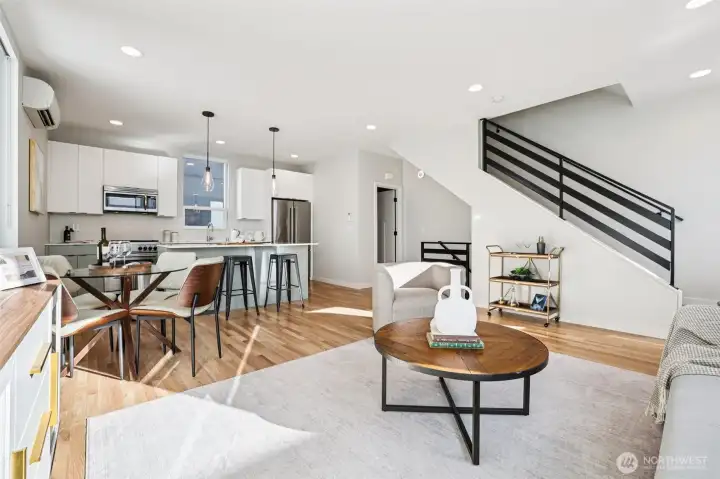 Sunlight fills every space to accentuate hardwood floors, high-end blinds, and stylish finishes throughout.