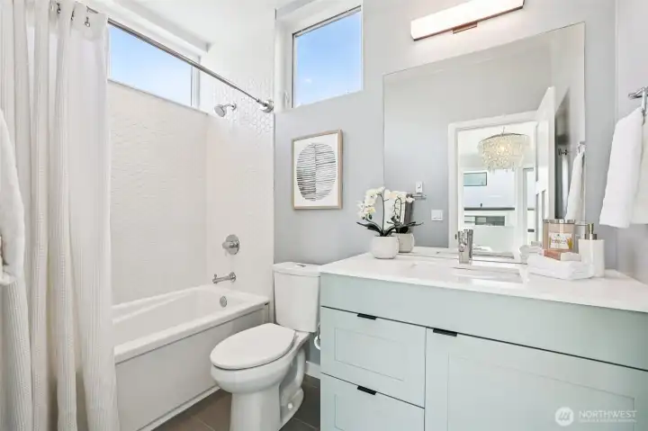 Stylishly appointed full bathroom off of the primary.