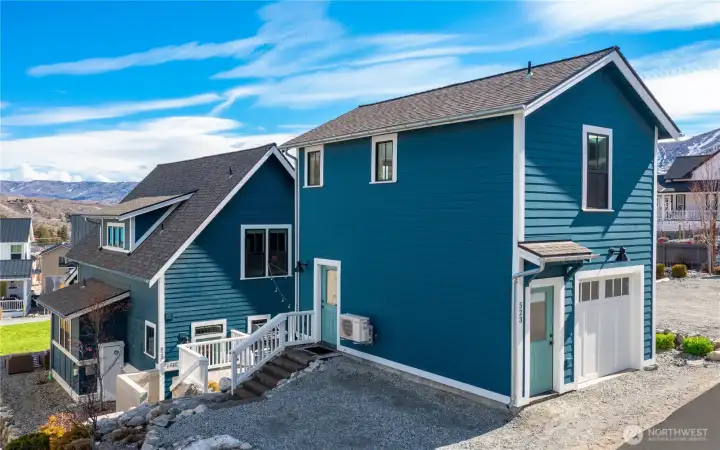 Exterior view 1 of parking area and 1-car garage carriage house.
