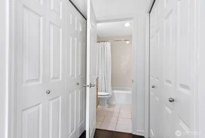 Double closets that lead into bathroom.
