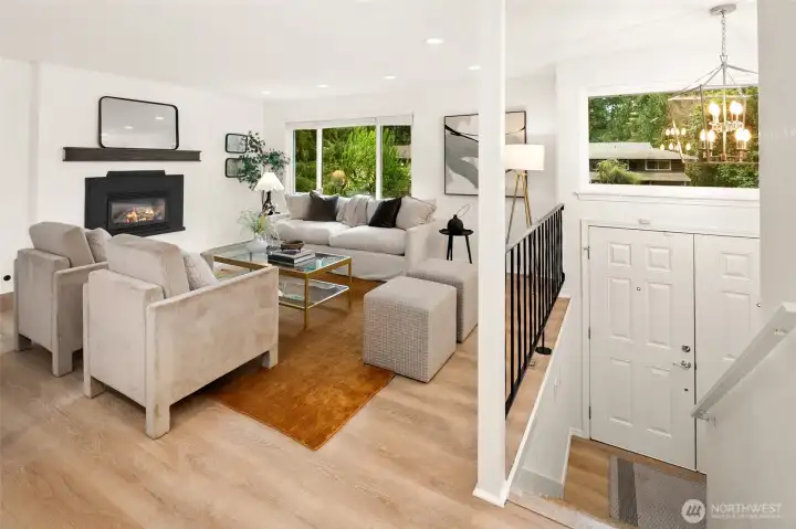 Open concept living/dining/kitchen w/beautiful oak-colored flooring & recessed lighting