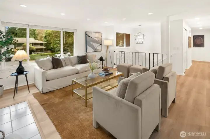 Open concept living/dining/kitchen w/beautiful oak-colored flooring & recessed lighting