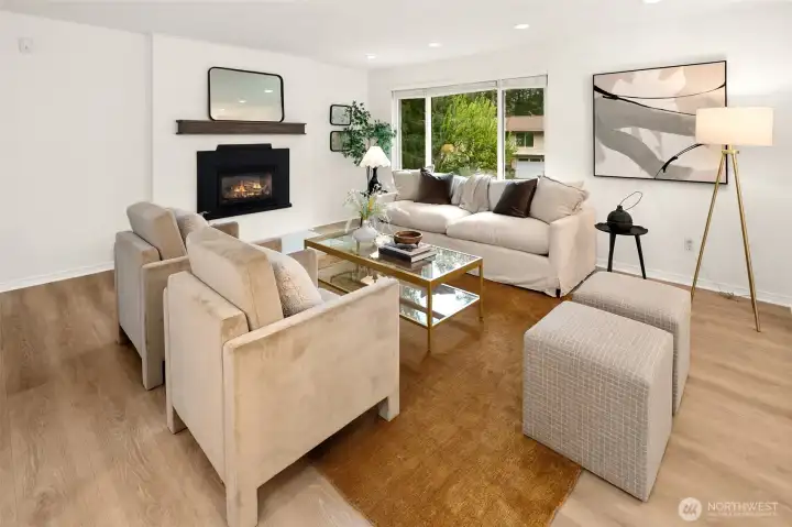 Open concept living/dining/kitchen w/beautiful oak-colored flooring & recessed lighting