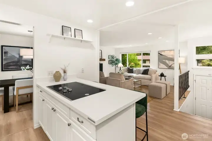 Open concept living/dining/kitchen w/beautiful oak-colored flooring & recessed lighting