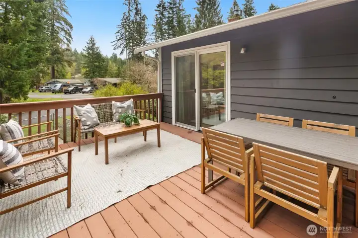 Large back deck overlooking expansive yard
