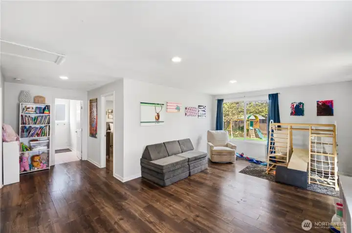 Bonus/Playroom, adjacent to bathroom and Primary