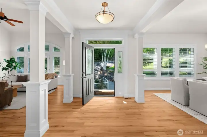 Inviting entry with hardwood floors, detailed millwork, and open sightlines to adjoining living spaces.