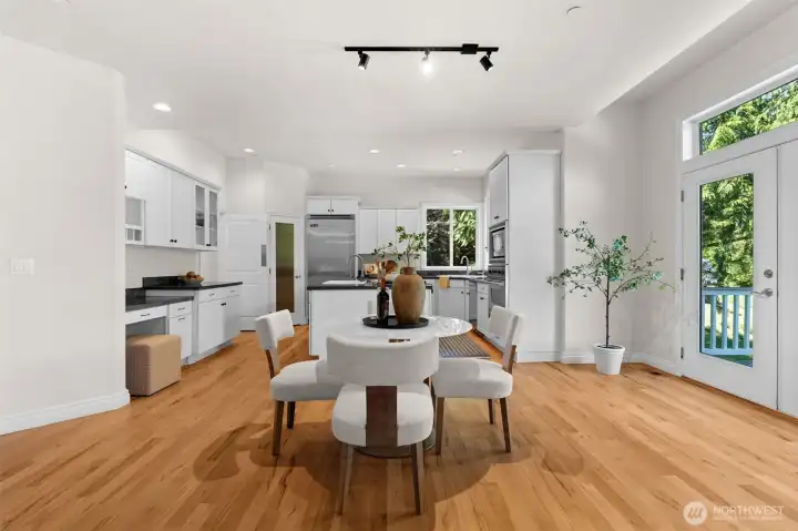 Spacious dining area just off the kitchen, offering a comfortable setting for casual meals and gatherings.