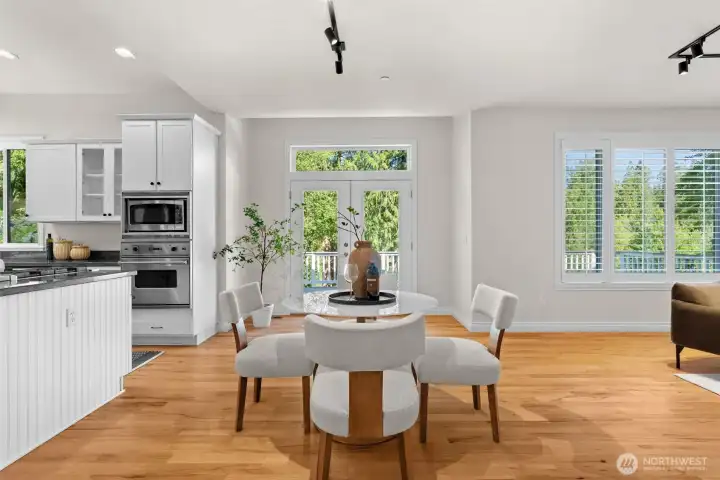 Casual dining area with access to the deck, creating an easy flow for indoor and outdoor entertaining.