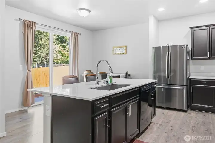 Great room, steps from back yard.