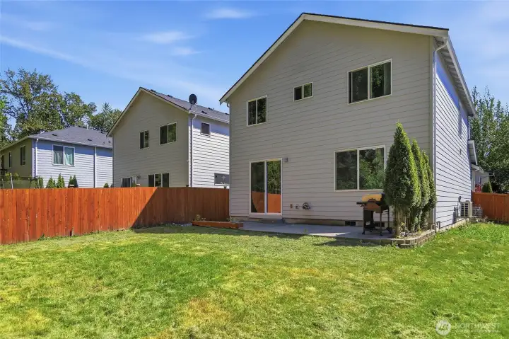 Fully fenced back yard, room to play, relax, garden