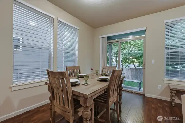 Dining area, high ceilings, covered patio, laminate flooring