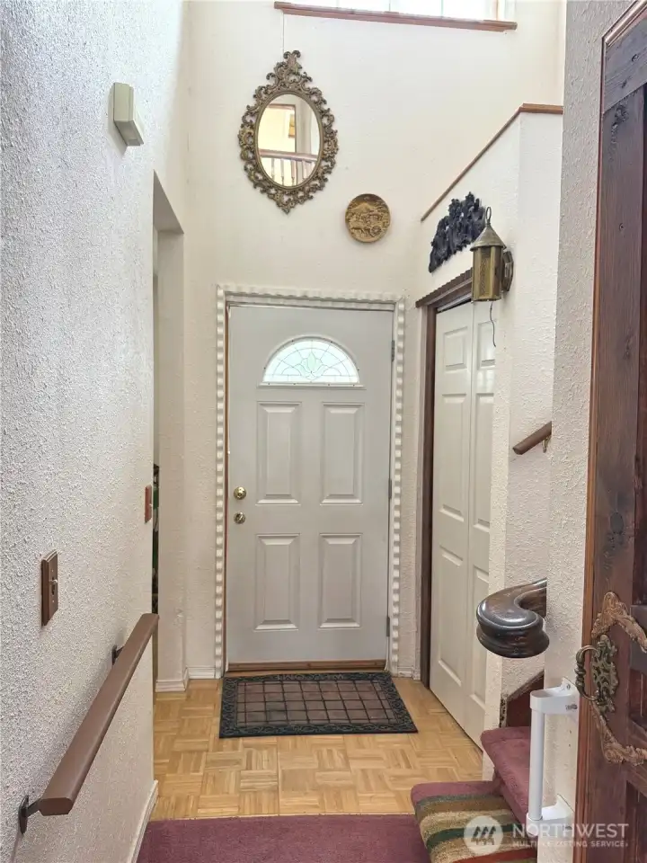 Formal entry with guest closet.