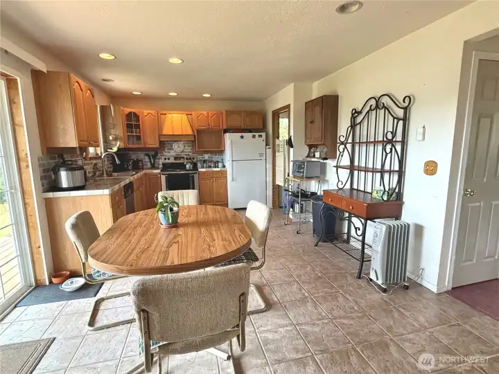 Great room concept with plenty of dining area opens to a sliding door to deck & canal front.