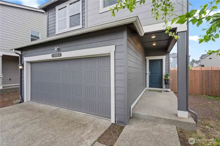 Covered front entry welcomes you into this beautifully maintained modern home.