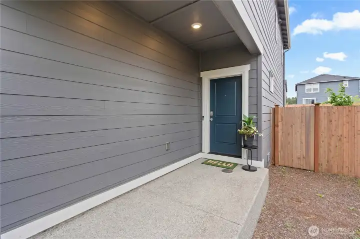 Inviting covered porch provides a welcoming arrival and additional outdoor living space.