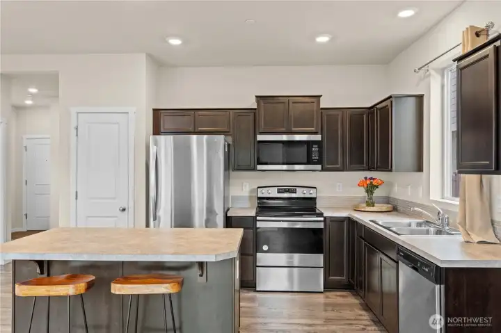 Modern kitchen with abundant cabinetry, ample counter space, and contemporary design.