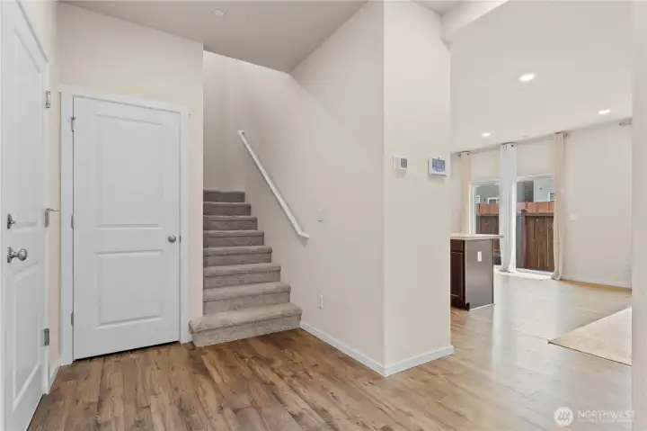 Bright and welcoming entryway with convenient access to the main living areas.