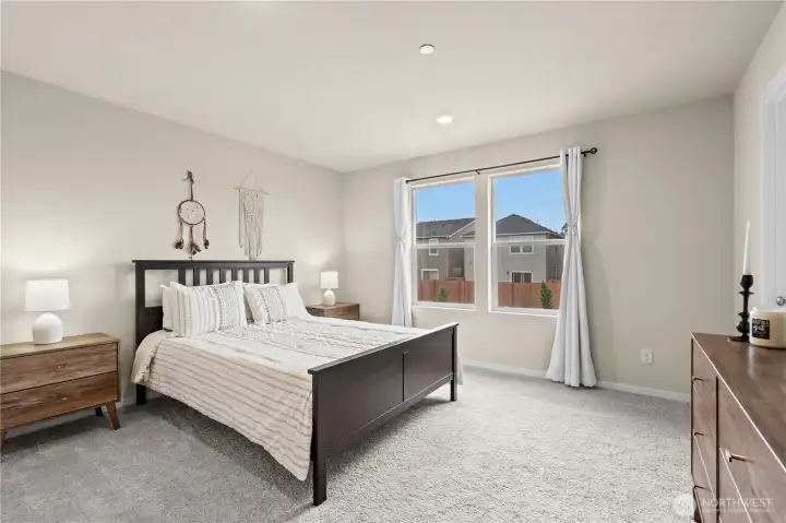 Generously sized primary suite with abundant natural light and private retreat feel.