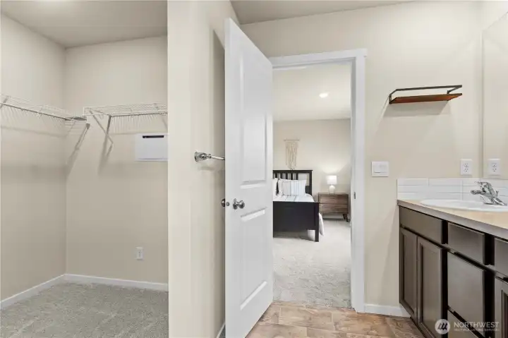 Expansive walk-in closet offering exceptional storage and organization.
