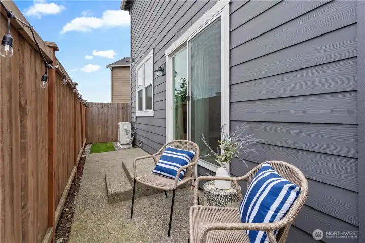 Private backyard patio provides the perfect space for outdoor dining, relaxing, and entertaining.