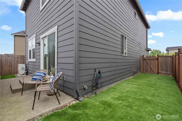 Fully fenced backyard with low-maintenance landscaping and room for pets, play, or gardening.