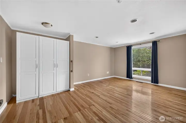 Main floor primary suite with private bathroom. Main floor primary suite with private bathroom.