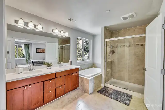 Primary bathroom with large soaking tub and dual sink