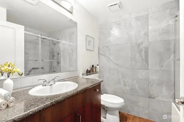 Large-format, floor-to-ceiling marble-look tile