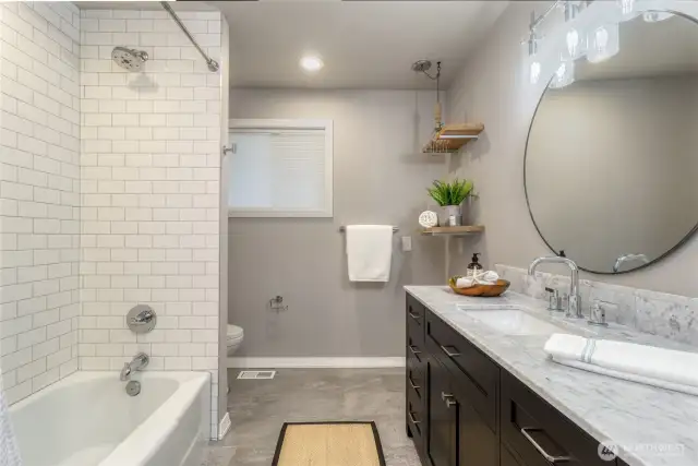 Hall Bath with tiled shower in the Main Home