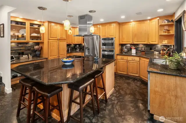 This kitchen is extra! You won't run out of storage and the huge island serves as a dining area, prep space, and hub for gatherings.