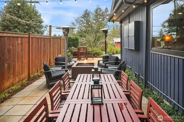The side yard has been transformed into a fabulous patio bistro and outdoor hangout.