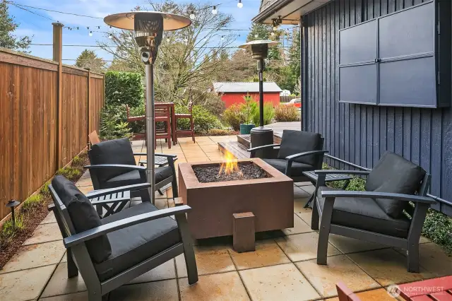 Enjoy an evening by the fire with friends and a movie. Yep, that's an outdoor TV tucked safely in the cabinet.