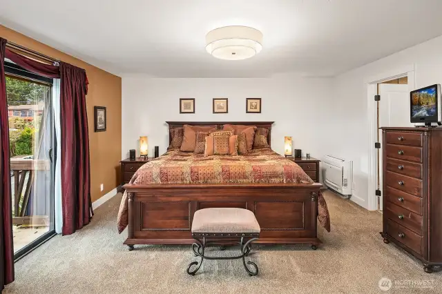 The ample primary bedroom features an en suite bath, private deck and ductless heat and air.