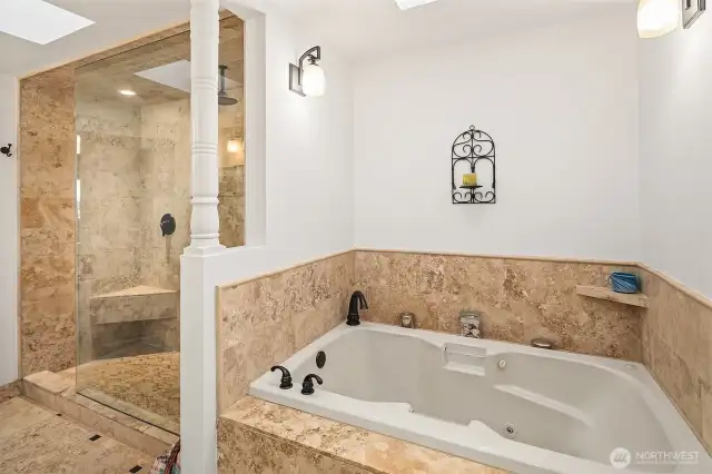 Jetted tub and step in rain shower.