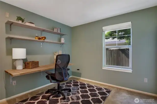 Second bedroom setup as an office and built desk stays.