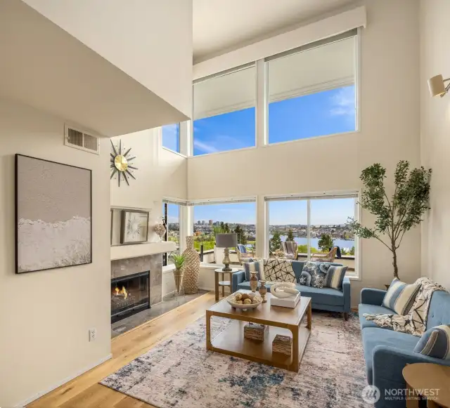 Soaring 25' ceilings set over new solid Australian hardwood floors opening to sweeping views of the lake and mountain range from both floors!