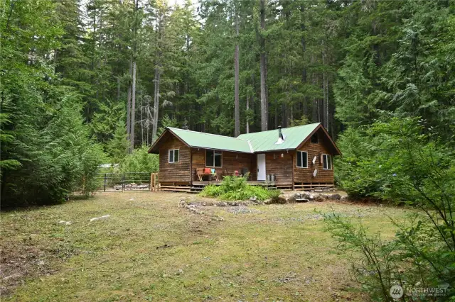 Private & surrounded by forests ~ Enjoy views of the river from your deck.