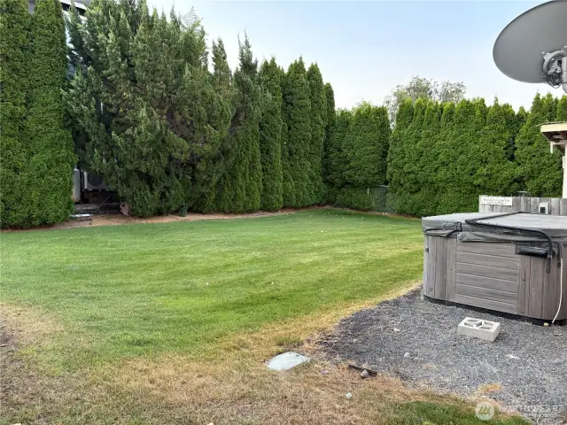 Nice private back yard with a hot tub. Lots of tree's for privacy