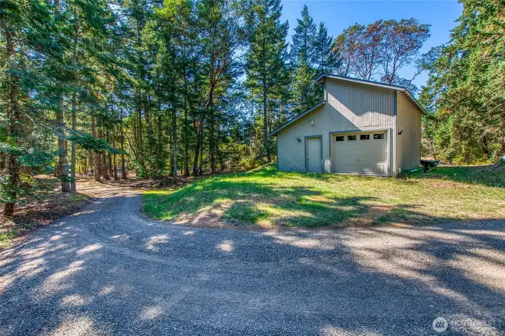 One-car garage with additional shop space.