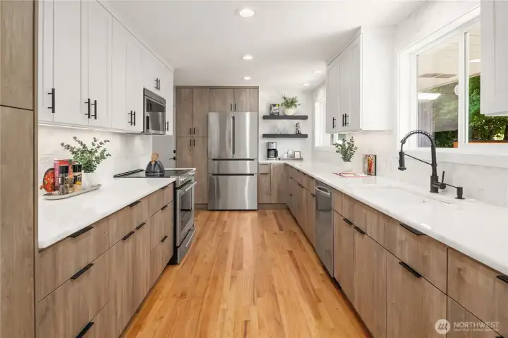 Completely Remodeled Kitchen. A Chefs dream of endless countertops. Roll out shelving. Soft Close Drawers. Coffee nook. All new appliances, Sink (motion sensor activated faucet and wireless remote garbage disposal)
