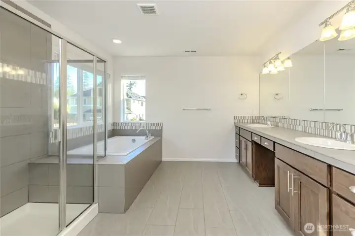 spacious primary bathroom.