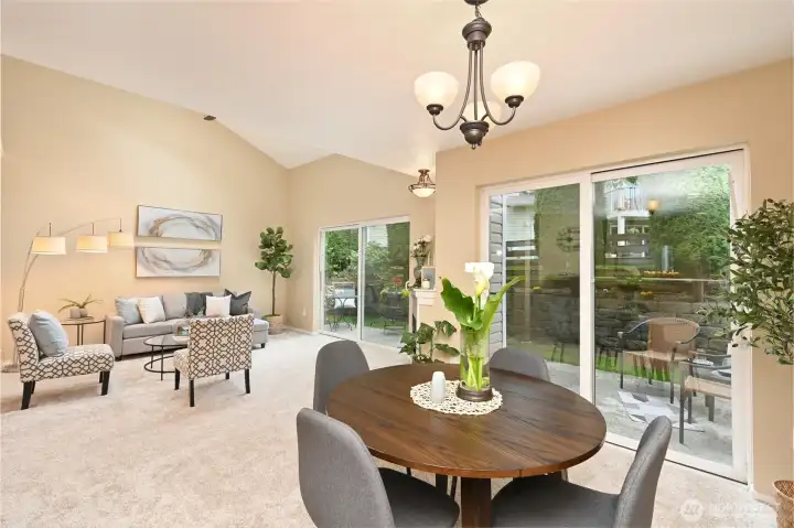 Great room with double sliders & skylights is light filled for indoor/outdoor living.