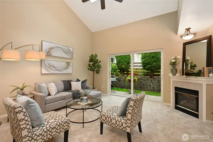 A cozy gas fireplace and large slider to outside invite you to relax & refresh.