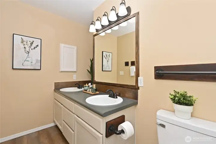 Your Primary ensuite with double sinks and new flooring.