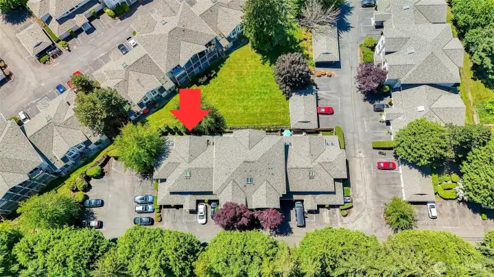 Complex & Unit view from above.  Lots of green space and trees.